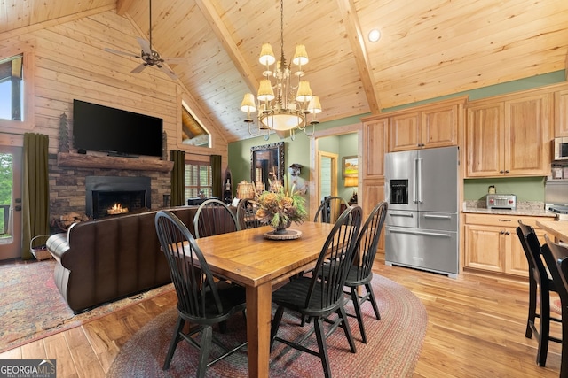 294 Turkey Trl, Jasper, GA 30143 - dining space featuring wood ceiling with exposed beams, a fireplace, a chandelier, high vaulted ceiling, and light wood-style flooring