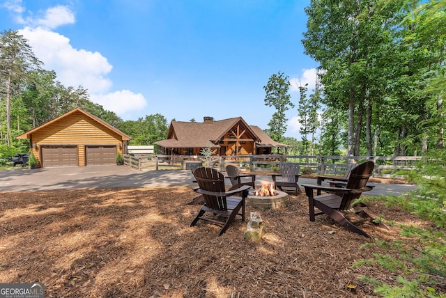 294 Turkey Trl, Jasper, GA 30143 - view of yard with an outdoor fire pit and a garage