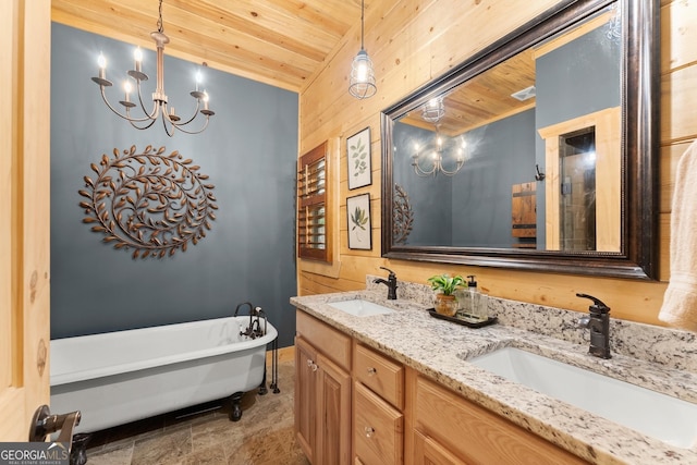 294 Turkey Trl, Jasper, GA 30143 - full bath featuring wood ceiling, a chandelier, double vanity, a freestanding tub, and stone finish floors