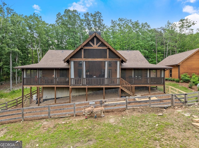 294 Turkey Trl, Jasper, GA 30143 - back of property featuring a sunroom, a fenced backyard, and a shingled roof