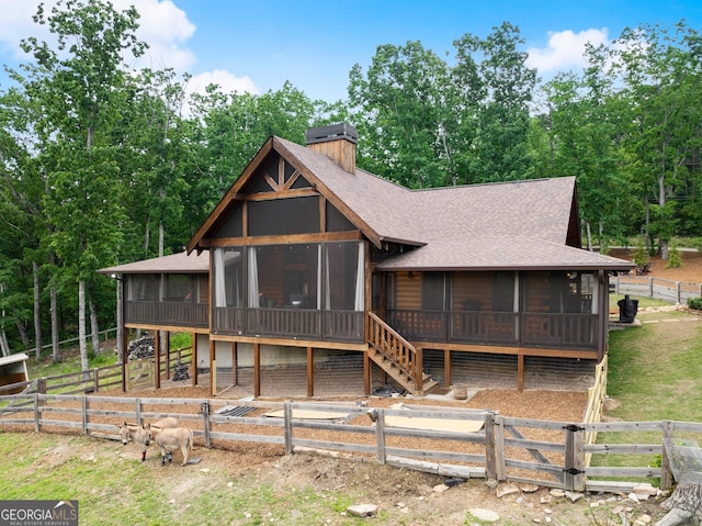 294 Turkey Trl, Jasper, GA 30143 - view of front of house with a sunroom, a chimney, and roof with shingles