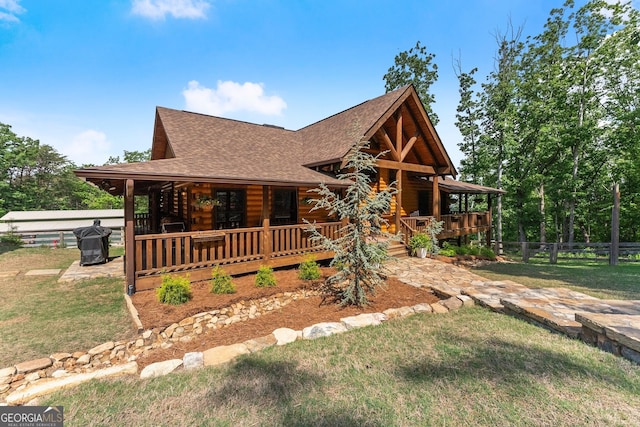 294 Turkey Trl, Jasper, GA 30143 - log-style house with a shingled roof and a porch
