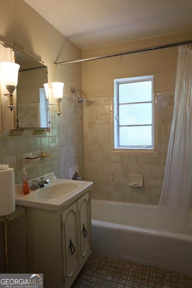 1381 NE Normandy Dr NE Unit 4, Atlanta, GA 30306 - bathroom with shower / tub combo with curtain, vanity, tile walls, decorative backsplash, and tile patterned floors