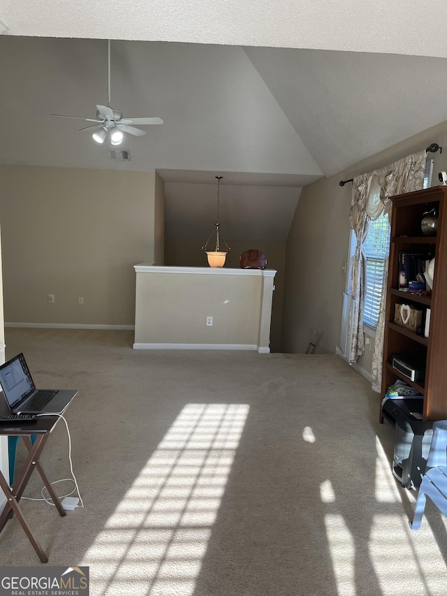 11657 Flemming Ct, Hampton, GA 30228 - unfurnished living room featuring vaulted ceiling, carpet flooring, ceiling fan, and baseboards