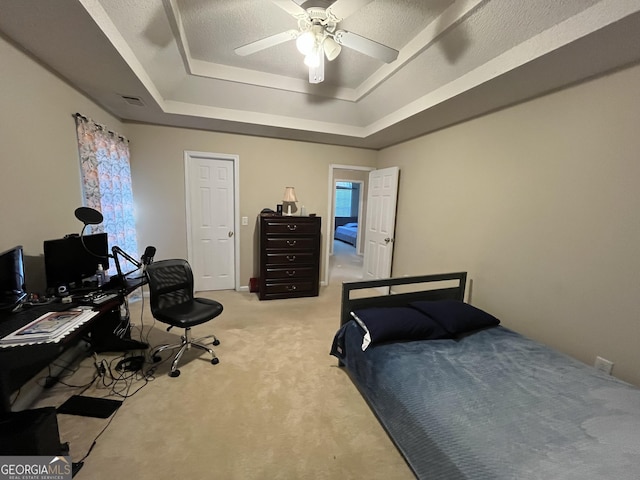 11657 Flemming Ct, Hampton, GA 30228 - bedroom with a raised ceiling, light colored carpet, an office area, and a ceiling fan