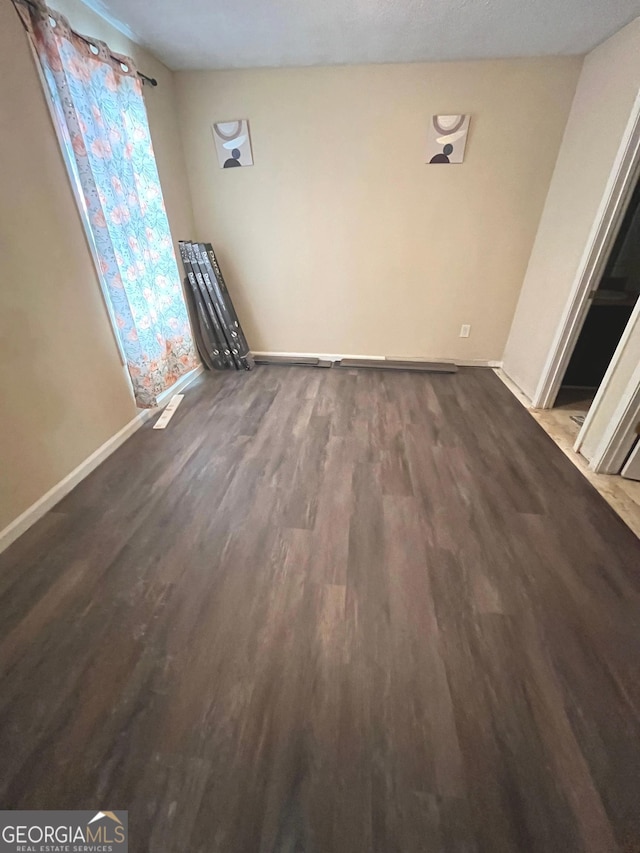 11657 Flemming Ct, Hampton, GA 30228 - unfurnished dining area featuring wood finished floors and baseboards
