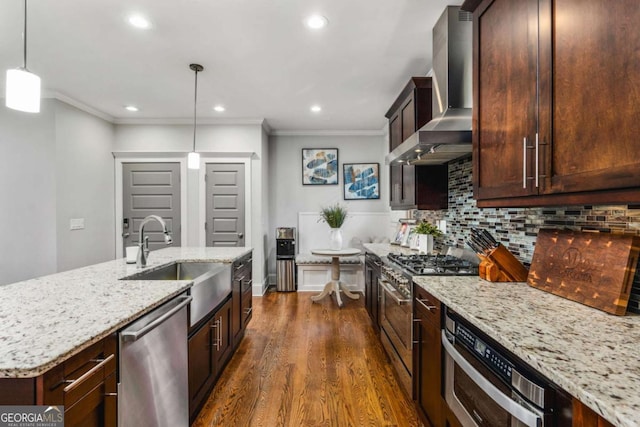 2603 Apple Valley Rd NE, Atlanta, GA 30319 - kitchen with stainless steel appliances, wall chimney range hood, ornamental molding, dark wood-style flooring, and light stone countertops