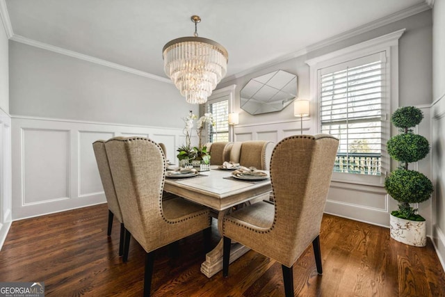2603 Apple Valley Rd NE, Atlanta, GA 30319 - dining space with a decorative wall, a chandelier, ornamental molding, and dark wood-type flooring