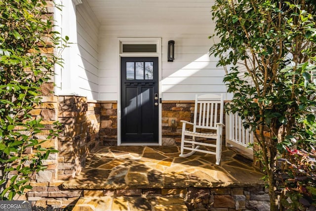 2603 Apple Valley Rd NE, Atlanta, GA 30319 - view of exterior entry with stone siding and a porch