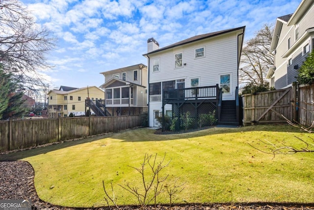 2603 Apple Valley Rd NE, Atlanta, GA 30319 - rear view of property with a chimney, stairs, a wooden deck, and a sunroom