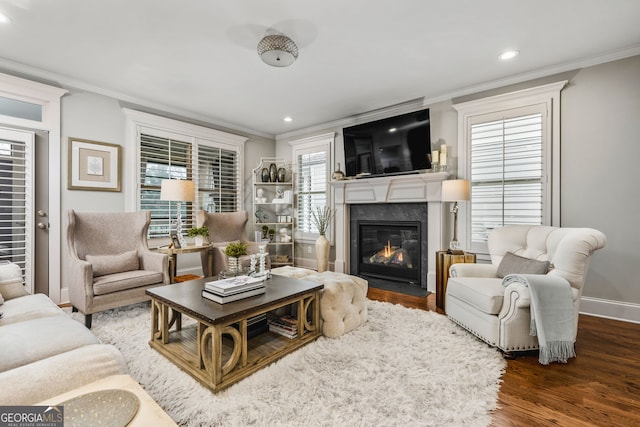 2603 Apple Valley Rd NE, Atlanta, GA 30319 - living room featuring crown molding, a fireplace, wood finished floors, and recessed lighting