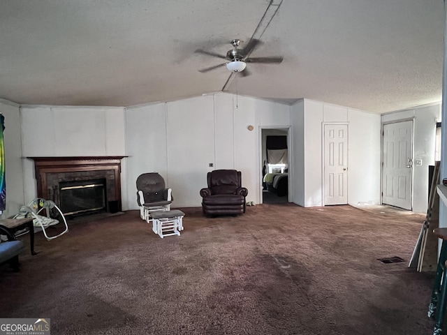 542 Southern Pines Rd, Dublin, GA 31021 - unfurnished living room featuring ceiling fan, carpet floors, a glass covered fireplace, and lofted ceiling