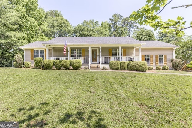 4407 Jones Rd, Macon, GA 31216 - ranch-style home featuring covered porch and a front lawn