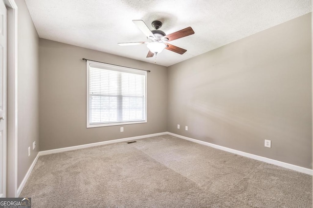 4407 Jones Rd, Macon, GA 31216 - carpeted spare room featuring ceiling fan, a textured ceiling, and baseboards