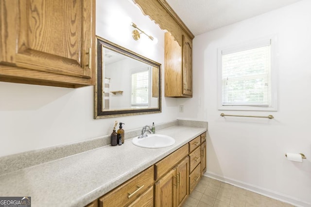 4407 Jones Rd, Macon, GA 31216 - bathroom with vanity, baseboards, and tile patterned flooring