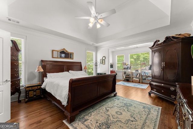 5176 Glen Forrest Dr, Flowery Branch, GA 30542 - bedroom with wood finished floors, a raised ceiling, a ceiling fan, and ornamental molding