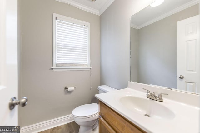 757 Silver Springs Dr, Macon, GA 31210 - bathroom featuring wood finished floors, toilet, vanity, ornamental molding, and baseboards