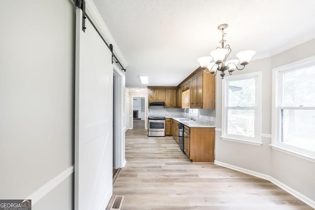 757 Silver Springs Dr, Macon, GA 31210 - kitchen featuring stainless steel electric range oven, a sink, a barn door, a chandelier, and brown cabinetry