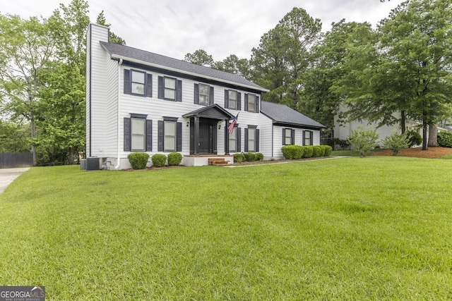 757 Silver Springs Dr, Macon, GA 31210 - colonial house featuring a chimney and central AC