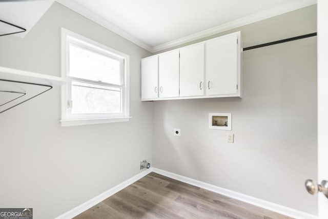 757 Silver Springs Dr, Macon, GA 31210 - laundry room featuring ornamental molding, electric dryer hookup, hookup for a washing machine, cabinet space, and wood finished floors