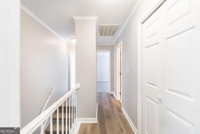 757 Silver Springs Dr, Macon, GA 31210 - corridor featuring an upstairs landing, wood finished floors, and ornamental molding