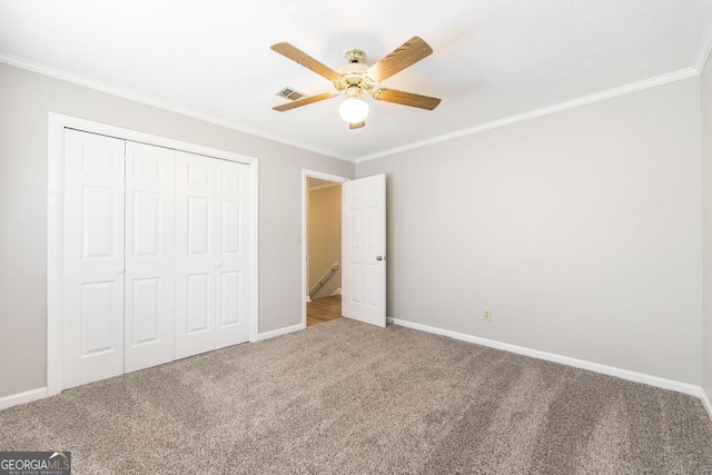 757 Silver Springs Dr, Macon, GA 31210 - unfurnished bedroom featuring ornamental molding, carpet, a closet, baseboards, and a ceiling fan