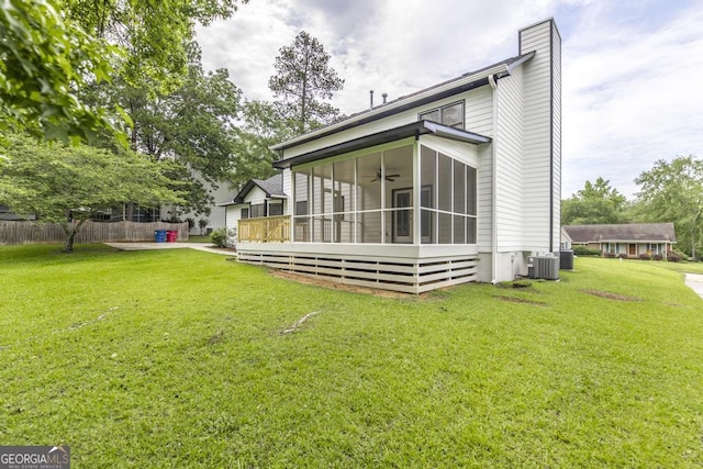 757 Silver Springs Dr, Macon, GA 31210 - rear view of property featuring a sunroom, a ceiling fan, and a chimney