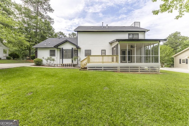 757 Silver Springs Dr, Macon, GA 31210 - rear view of house with a sunroom, a yard, a ceiling fan, and a chimney