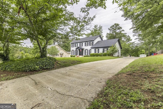 757 Silver Springs Dr, Macon, GA 31210 - colonial house featuring concrete driveway and a front yard