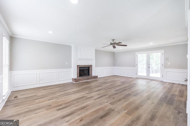 757 Silver Springs Dr, Macon, GA 31210 - unfurnished living room with ceiling fan, crown molding, recessed lighting, wainscoting, and a decorative wall