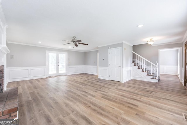 757 Silver Springs Dr, Macon, GA 31210 - unfurnished living room with stairway, a fireplace, ceiling fan, a decorative wall, and ornamental molding