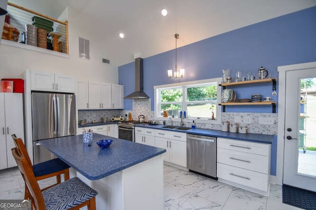 132 Fairview Meadows Dr, Demorest, GA 30535 - kitchen with stainless steel appliances, light marble finish flooring, high vaulted ceiling, dark countertops, and a breakfast bar