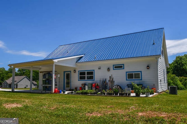 132 Fairview Meadows Dr, Demorest, GA 30535 - back of property with a yard and a metal roof