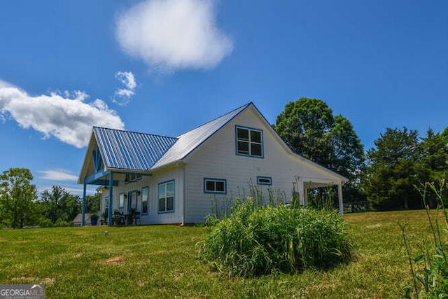 132 Fairview Meadows Dr, Demorest, GA 30535 - view of property exterior featuring a yard and a metal roof
