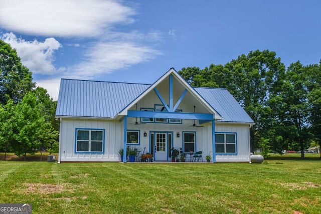 132 Fairview Meadows Dr, Demorest, GA 30535 - view of front facade with board and batten siding, a front lawn, and a metal roof