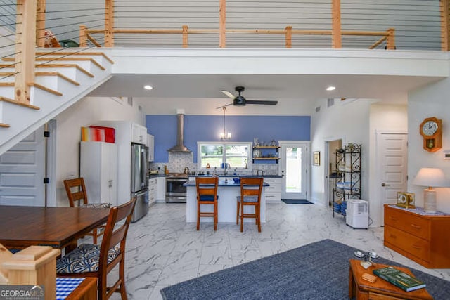 132 Fairview Meadows Dr, Demorest, GA 30535 - dining area featuring light marble finish flooring, ceiling fan, stairs, and recessed lighting