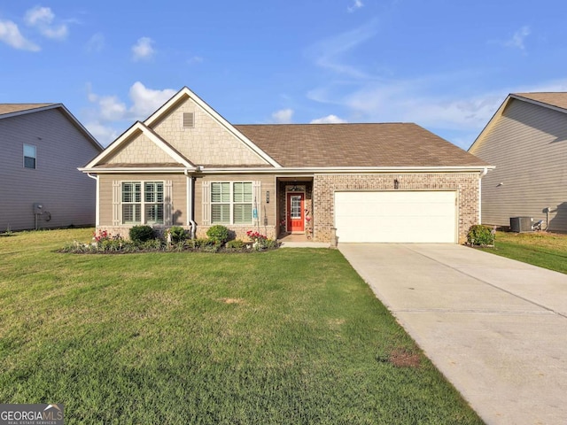 103 Crowley Dr, Calhoun, GA 30701 - view of front facade featuring an attached garage, concrete driveway, a front lawn, and brick siding