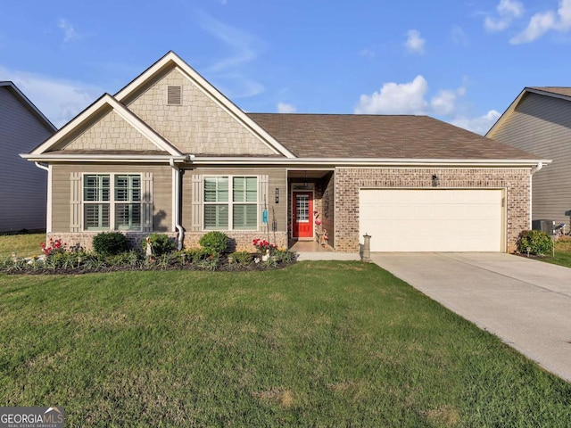 103 Crowley Dr, Calhoun, GA 30701 - view of front facade featuring brick siding, a garage, driveway, and a front lawn