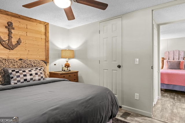 158 Montego Bay Rd NW, Milledgeville, GA 31061 - bedroom featuring a textured ceiling, wood finished floors, and ceiling fan