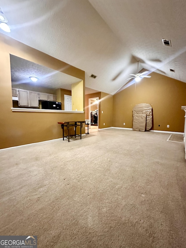 3793 SW Mays Ct SW, Atlanta, GA 30331 - bonus room featuring carpet, vaulted ceiling, ceiling fan, baseboards, and a textured ceiling