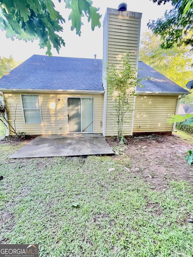 3793 SW Mays Ct SW, Atlanta, GA 30331 - back of house featuring a chimney, a patio, and roof with shingles