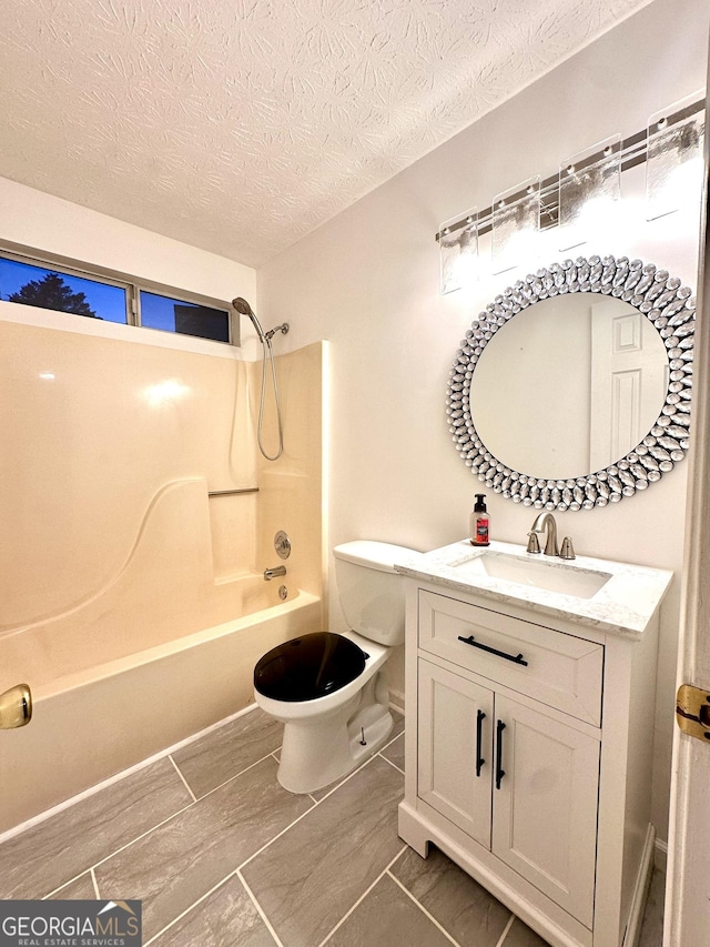 3793 SW Mays Ct SW, Atlanta, GA 30331 - bathroom with bathtub / shower combination, vanity, toilet, and a textured ceiling