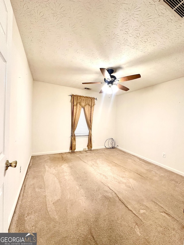 3793 SW Mays Ct SW, Atlanta, GA 30331 - carpeted empty room with a ceiling fan, a textured ceiling, and baseboards