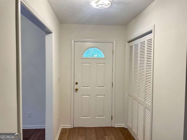 1028 Gate Post Ln, Lawrenceville, GA 30044 - foyer entrance with dark wood-type flooring and baseboards