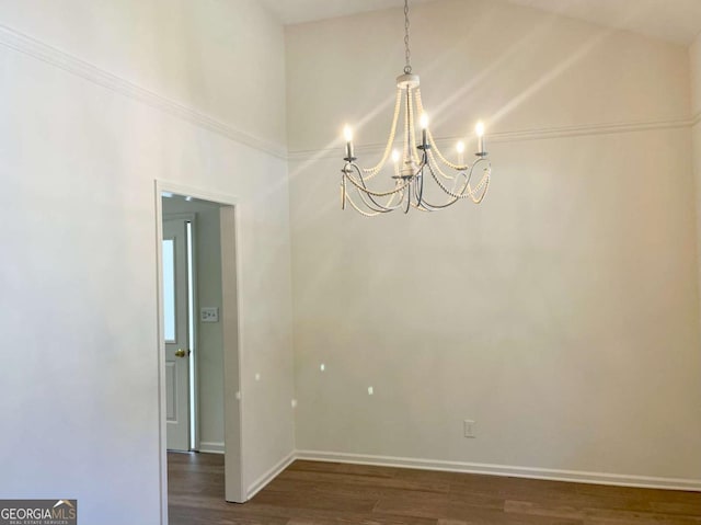 1028 Gate Post Ln, Lawrenceville, GA 30044 - spare room featuring a chandelier, dark wood-style floors, baseboards, and a high ceiling