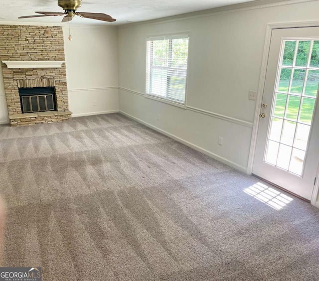 1028 Gate Post Ln, Lawrenceville, GA 30044 - unfurnished living room with ornamental molding, carpet flooring, a ceiling fan, and baseboards