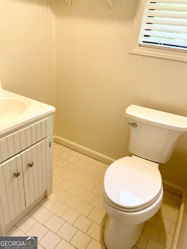 1028 Gate Post Ln, Lawrenceville, GA 30044 - half bath with vanity, toilet, and tile patterned floors