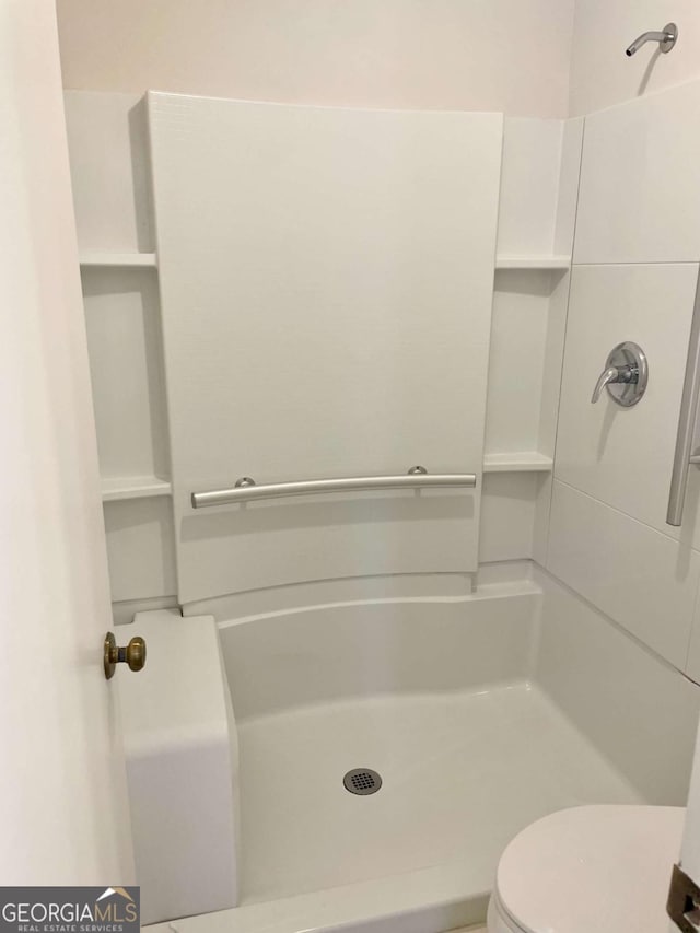 1028 Gate Post Ln, Lawrenceville, GA 30044 - full bath with a stall shower and toilet