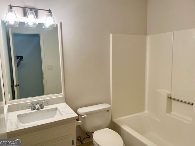 1028 Gate Post Ln, Lawrenceville, GA 30044 - bathroom featuring toilet, vanity, and shower / bathtub combination