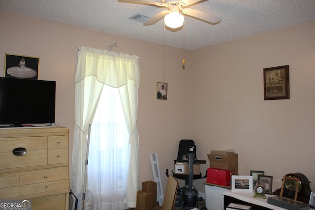 239 Ferguson Ave, Locust Grove, GA 30248 - bedroom with a textured ceiling and ceiling fan